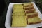 Bika Ambon, Indonesian cake with square slices in white plate. Yellow cake from Medan, Indonesia