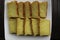 Bika Ambon, Indonesian cake with square slices in white plate. Yellow cake from Medan, Indonesia