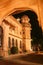 Bikaner Palace lit up by night. Grandmother and Grandson on their way home