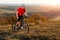 Bike adventure travel photo. Cyclist on the Beautiful Meadow Trail on sunny day.