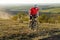 Bike adventure travel photo. Cyclist on the Beautiful Meadow Trail on sunny day.