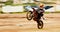 Bike, balance and motion blur with a man on space at a race for a dirt biking challenge. Motorcycle, speed and power