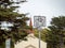 Bike lane end sign handing in front of a church outdoors