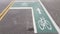 Bike lane markings on black asphalt or road