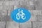Bike lane sign on the asphalt in the city. Sustainable urban mobility.