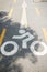 Bike lane signs painted onto road bike lane