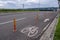 Bike lane on suburban street. Bicycle path. Sign for bicycle painted on the asphalt.