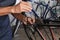 Bike maintenance. Closeup of a technicians hands using a screwdriver to make fine adjustments to a Bicycle derailleur