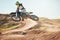 Bike, motorcycle and offroad sports with motion blur, speed challenge and desert. Driver, cycling and air jump on dirt