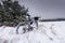 Bike off the trail buried in snow in winter scenery