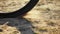 Bike rear wheel skids slips and brakes on the sand in slow motion, wheelspin close up. Cross-country mountain bicycle