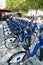 Bike rental station with many blue and white bikes in the city of Rennes in Brittany in France