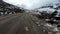 Bike ridding at remote himalayan isolated road with snow cap mountains at background