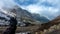 Bike ridding at remote himalayan isolated road with snow cap mountains at background