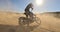 Bike, sand and power with man off road for action, competition or performance on dirt track. Dust, motorcycle and summer