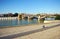 Bike in Seville at the Guadalquivir River and panoramic view of the Triana Bridge, Spain