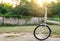 Bike silver folding parked on wall background