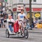 Bike taxi with passengers at Dam Square, Amsterdam, Netherlands