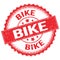 BIKE text on red round stamp sign