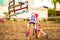 Bike toy wooden Doll toy swing in a public park swing childhood joy