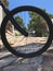 Bike Wheel. Mountain, ramp, trees and sky.