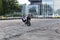 Bike wheelie motorcycle stunt rider on tarmac