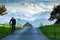 biker on a country road Swiss alps in the background healthy lifestyle