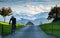 biker on a country road Swiss alps in the background healthy lifestyle