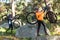 Biker couple holding their mountain bike and walking in forest