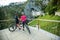 Biker couple looking at Predjama Castle inside Postojna cave in Slovenia