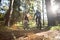 Biker couple riding mountain bike in the forest