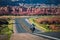 Biker driving on motorbike, Route 66, Arizona. Panoramic picture of a scenic road, USA. Natural american landscape with