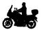 Biker driving a motorcycle rides along the asphalt road silhouette. Man on bike silhouette.