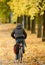 Biker driving at park in Autumn