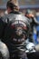 Biker in a jacket with the words FREE RIDER and NO CLUB and emblem - skull in a beret of the Russian Marine Corps