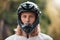 Biker man portrait, helmet and face of outdoor rider with head safety gear for adventure, cycling and motorcycle workout