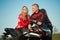 Biker man and woman sitting on a motorcycle