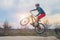 Biker on a mountain bike performing a jump. Active lifestyle