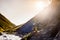 Biker pushes his bicycle up in high Caucasus mountains