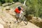 Biker pushing his bike on a hill at an MTB race 