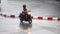 A biker ride on a motorcycle at wet street during a heavy rain