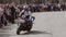 Biker rides on his hind legs on a motorcycle to the camera. Very cool performance of tricks on the bike.