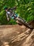 Biker riding with aggressive turns. Mountain Bike cyclist riding single track