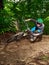 Biker riding with aggressive turns. Mountain Bike cyclist riding single track