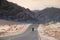 Biker riding alone on the desert highway