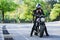 Biker sits on a motorcycle and fastens his helmet in preparation for the ride