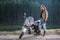 Biker standing by his custom made cruiser motorcycle