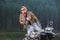 Biker standing by his custom made cruiser motorcycle