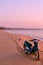 Biker on sunrise beach beautiful view