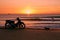 Biker on sunrise beach beautiful view